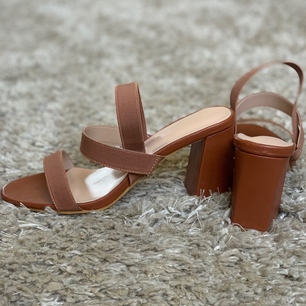 Tan strappy heels.